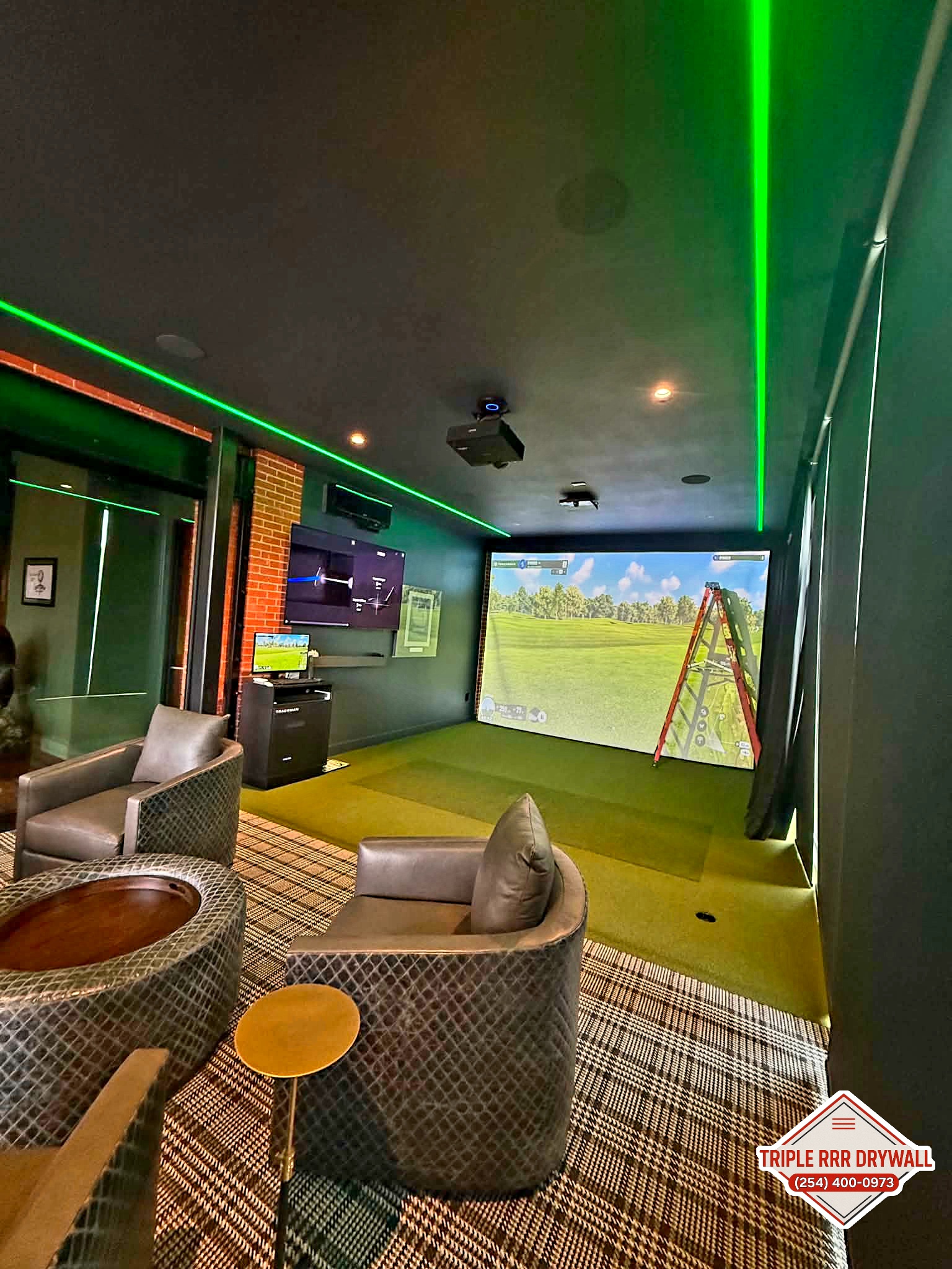 Finished golf simulator room in Waco Texas with Level 5 drywall finish and dark painted walls by Triple RRR Drywall