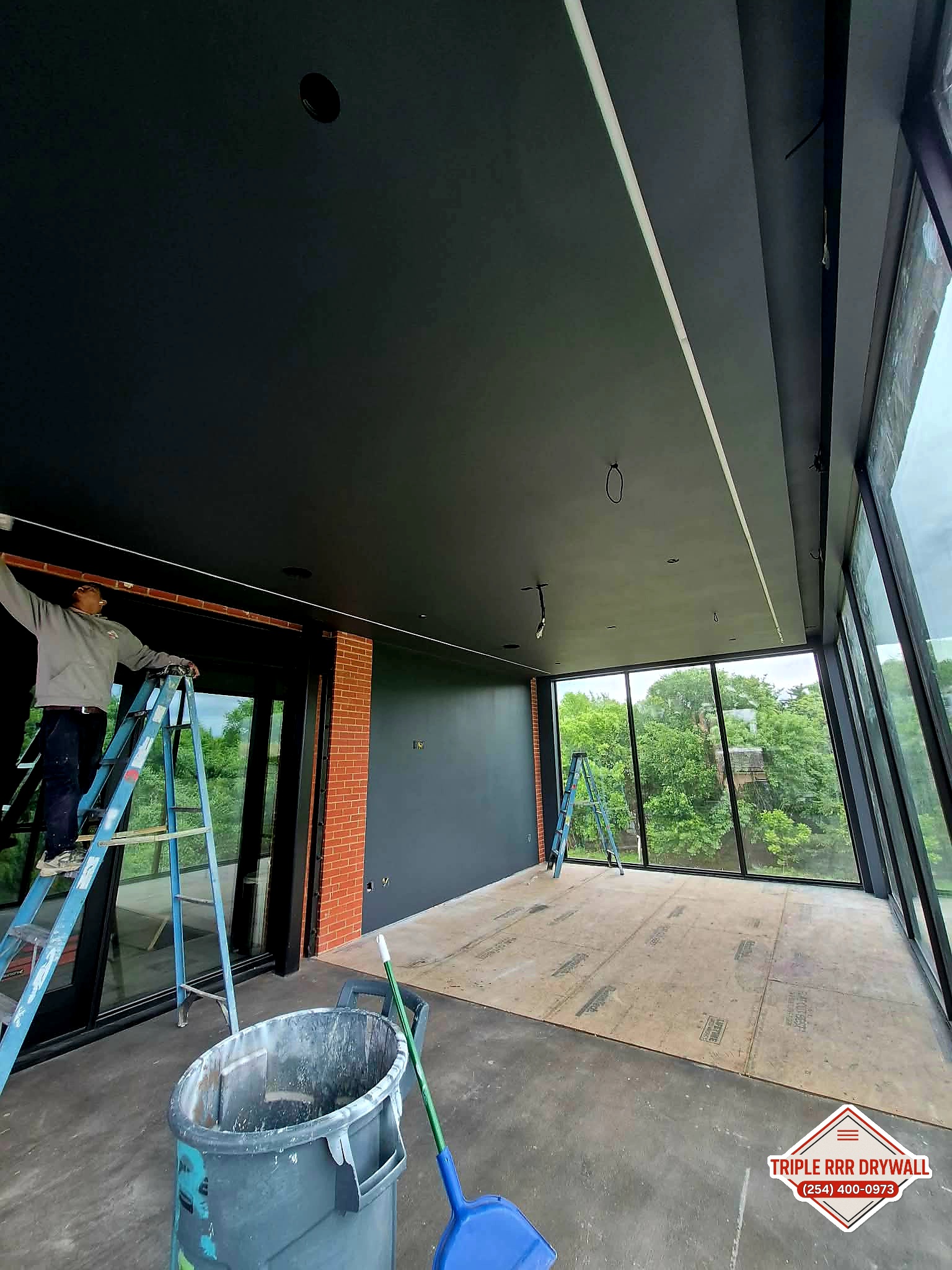 Level 5 smooth drywall finish and paint in a custom golf simulator room in Waco Texas