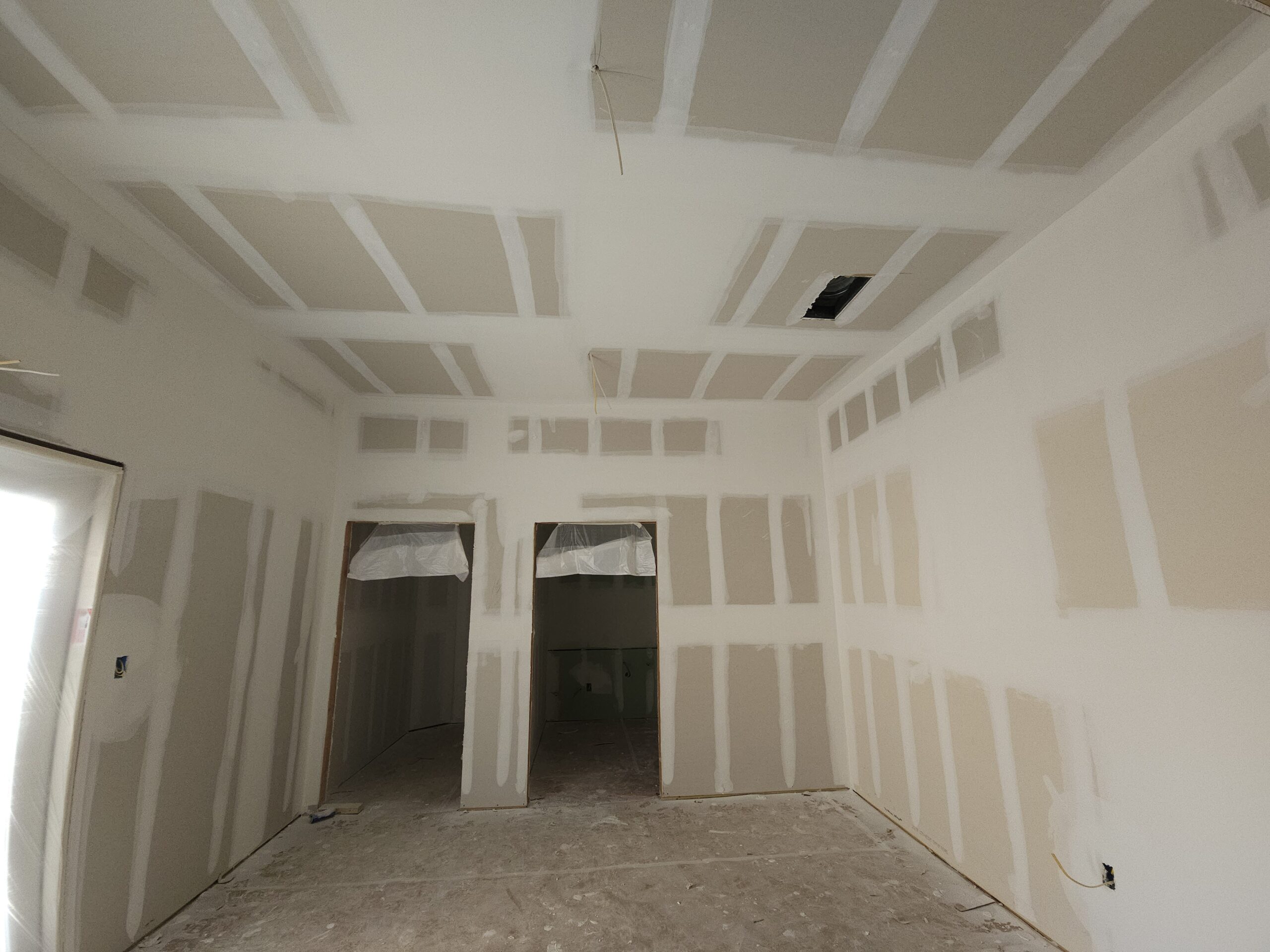 Tape and float work on newly installed drywall in Waco TX